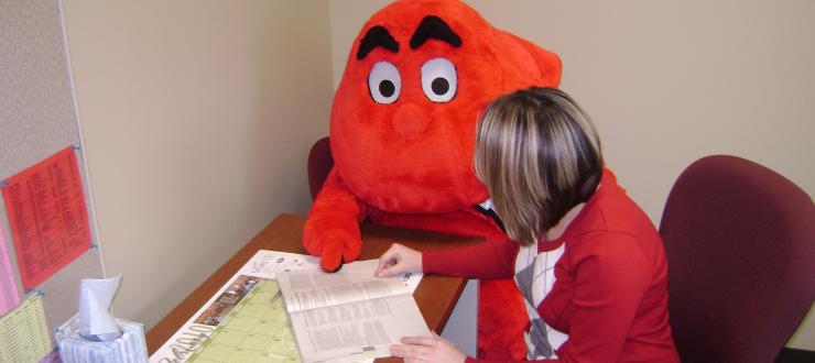 Picture of Big Red being advised 