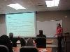 Megan Paschall updates the staff about what she learned and the sessions she attended.