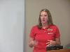 Megan Paschall updates the staff about what she learned and the sessions she attended.