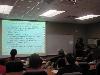 Jataun Isenhower updates the staff about what she learned and the sessions she attended.