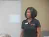 Jataun Isenhower updates the staff about what she learned and the sessions she attended.