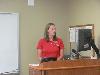 Megan Paschall updates the staff about what she learned and the sessions she attended.