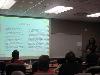 Jataun Isenhower updates the staff about what she learned and the sessions she attended.