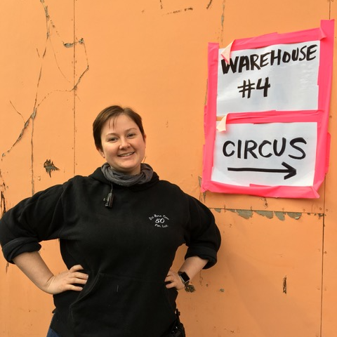 A picture of Grace Delahanty next to a sign that says "Warehouse #4"