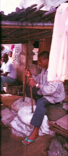 A blacksmith at work in his village