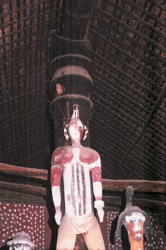 Figure of Uma Ukpai's wife on her husband's shoulder in the Obunkwa