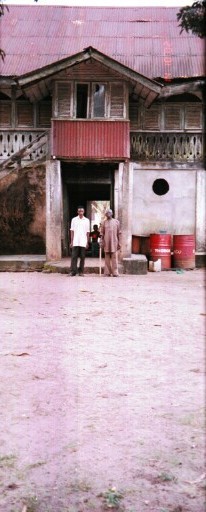 Mr. Brown Eke Kalu (right) and his brother in front of their father's house