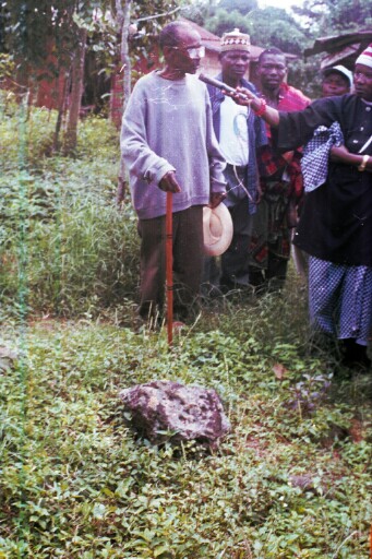Elder narrating a legend in the ancestral compound of the Abuma people