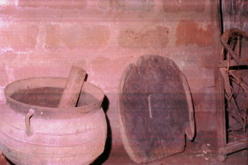 Iron cooking pot and wooden tray