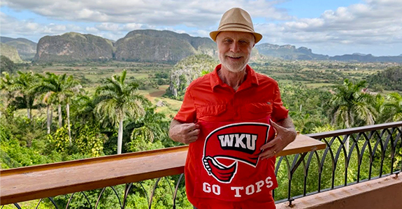 Image of a man holding a Red Towel in Cuba