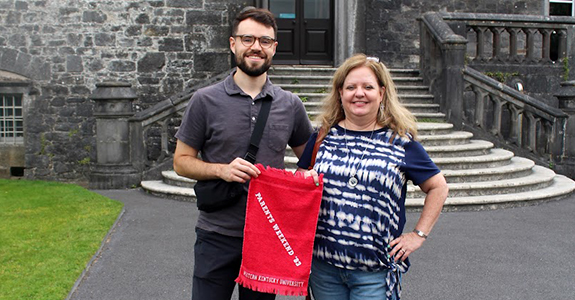 Mother and son posing with a red towel in Ireland