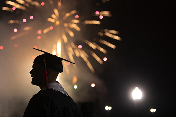 Picture of student and fireworks