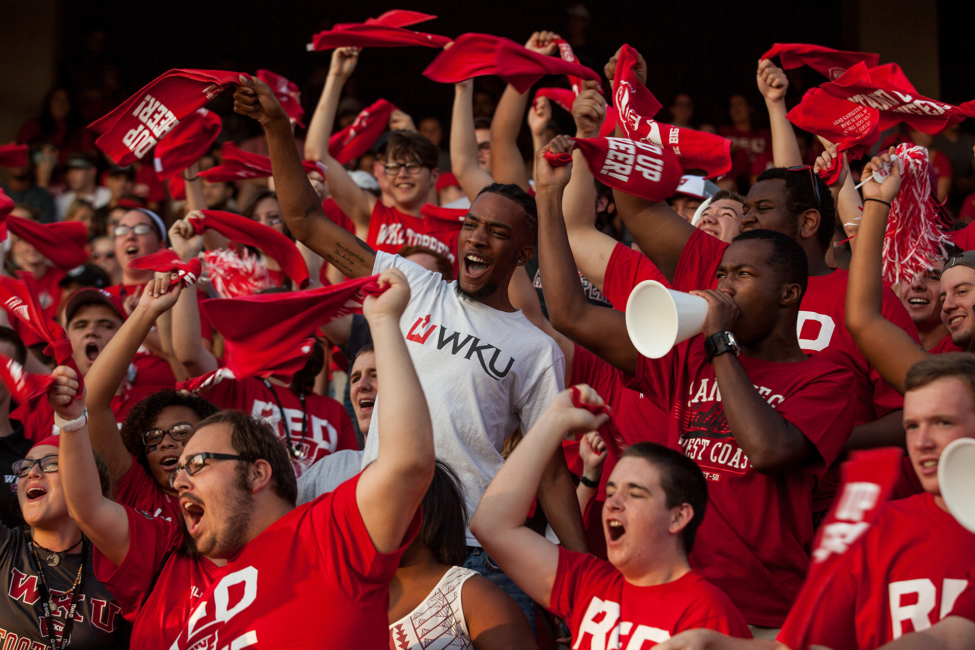 Students celebrating at a WKU football game.