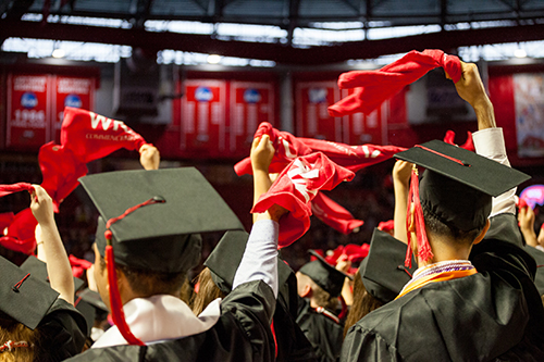 WKU Graduates waving their red towels
