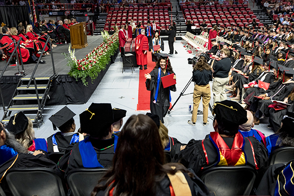 WKU faculty members watch as graduate waves WKU faculty members watch as graduate waves