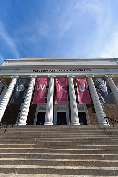 front steps of van meter hall at wku with wku banners
