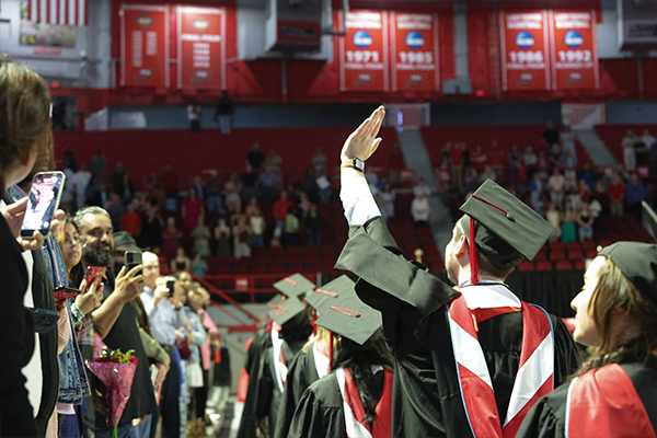 WKU Graduate waving at family