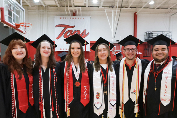 WKU graduates posing for a photo before the college recognition ceremony