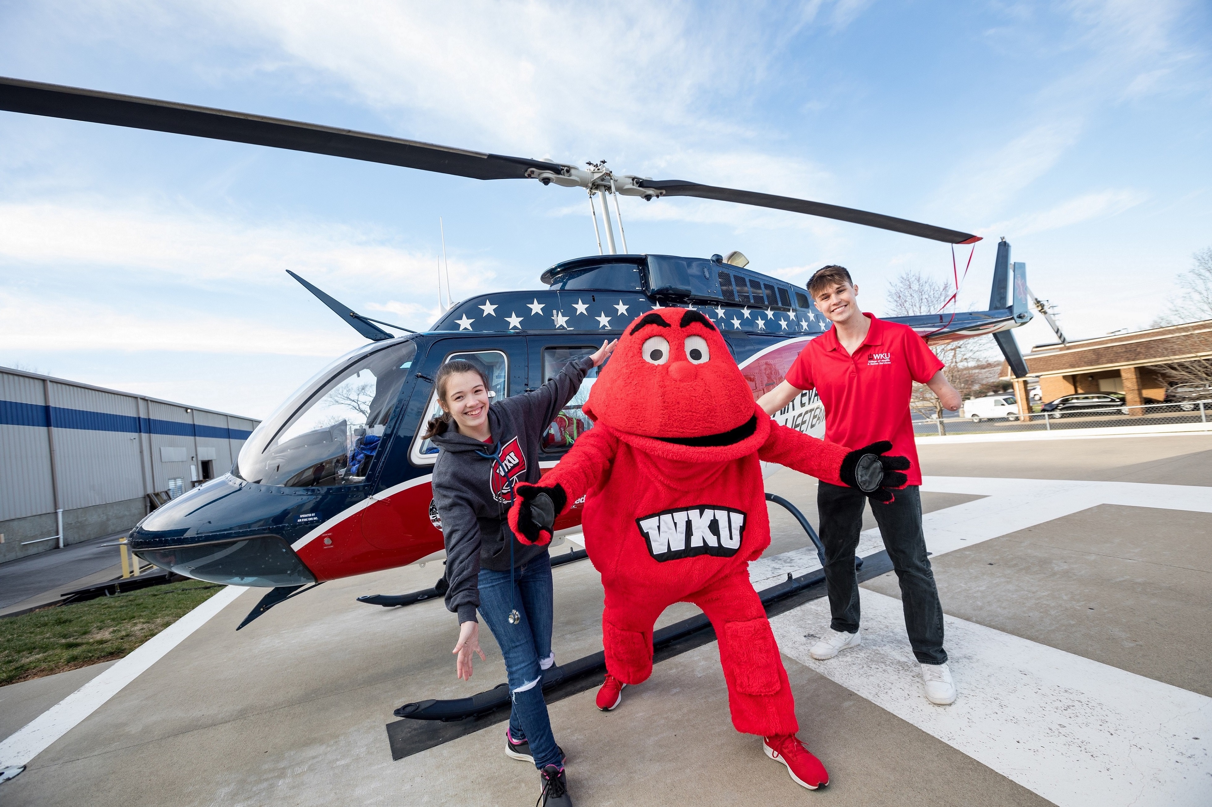 Big Red with Students by Helicopter