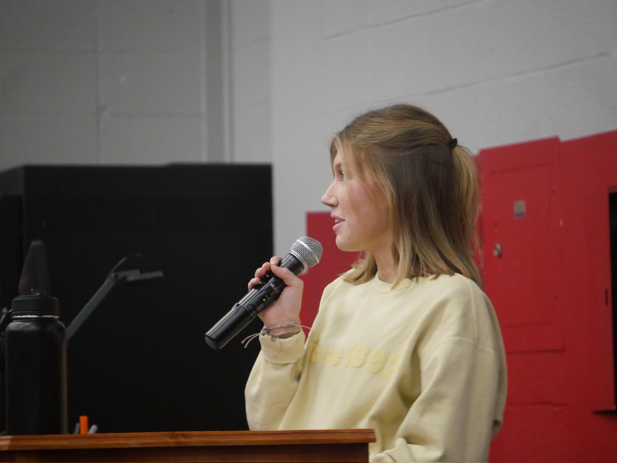 Student speaking at Open Mic Night