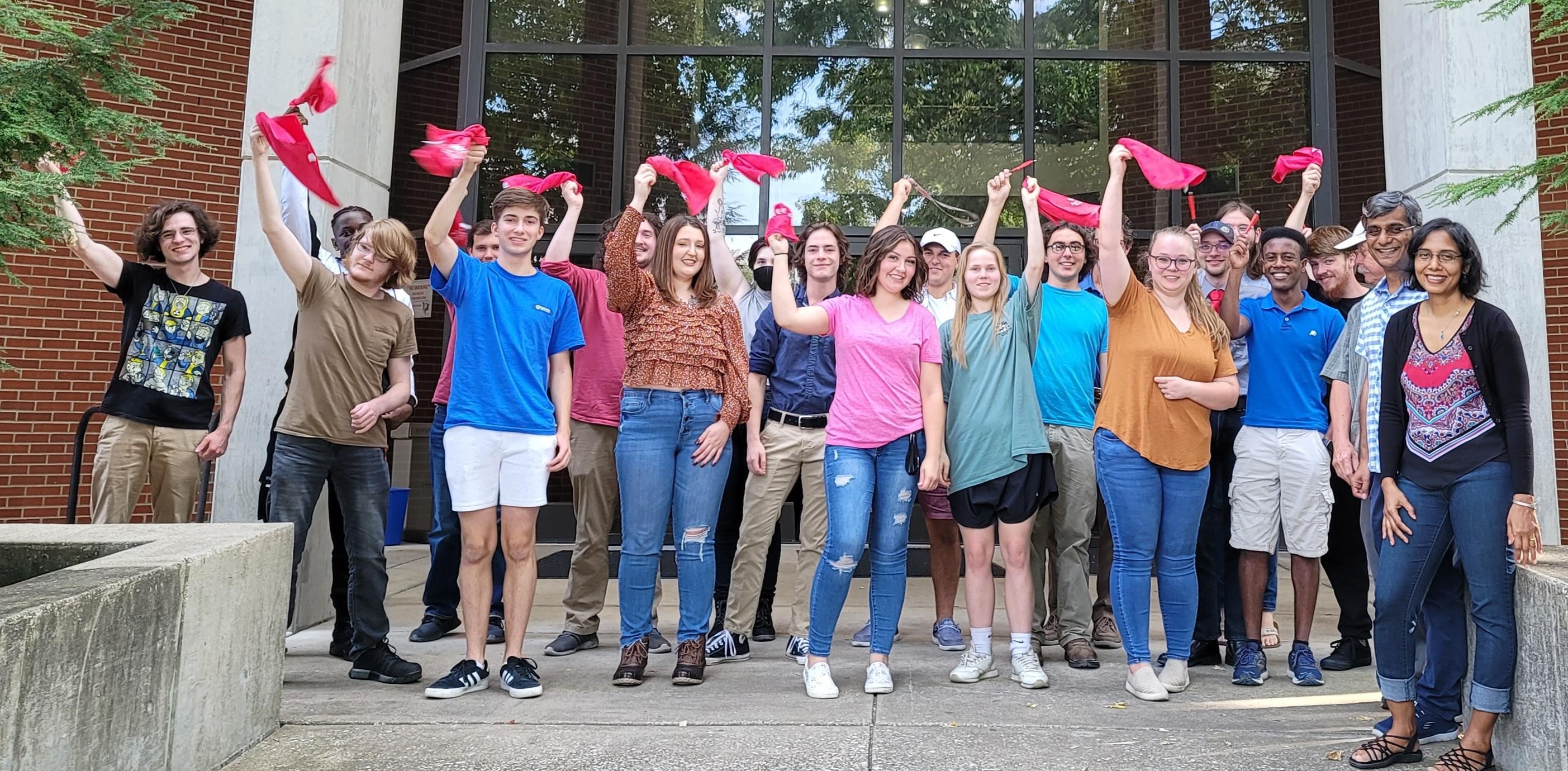Students waving flags