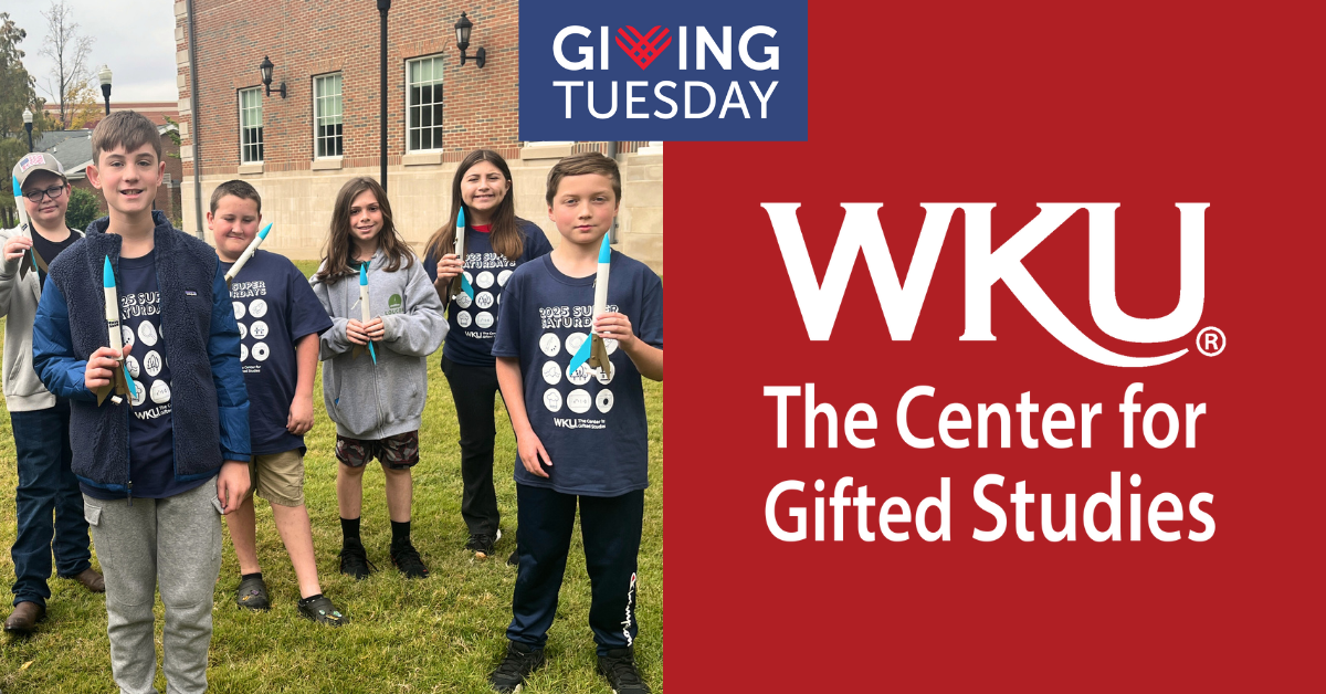 a group of boys and girls in matching navy shirts smiling at the camera while outside holding rockets they made