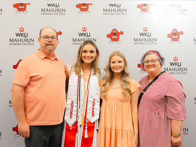 blonde young woman with family at graduation