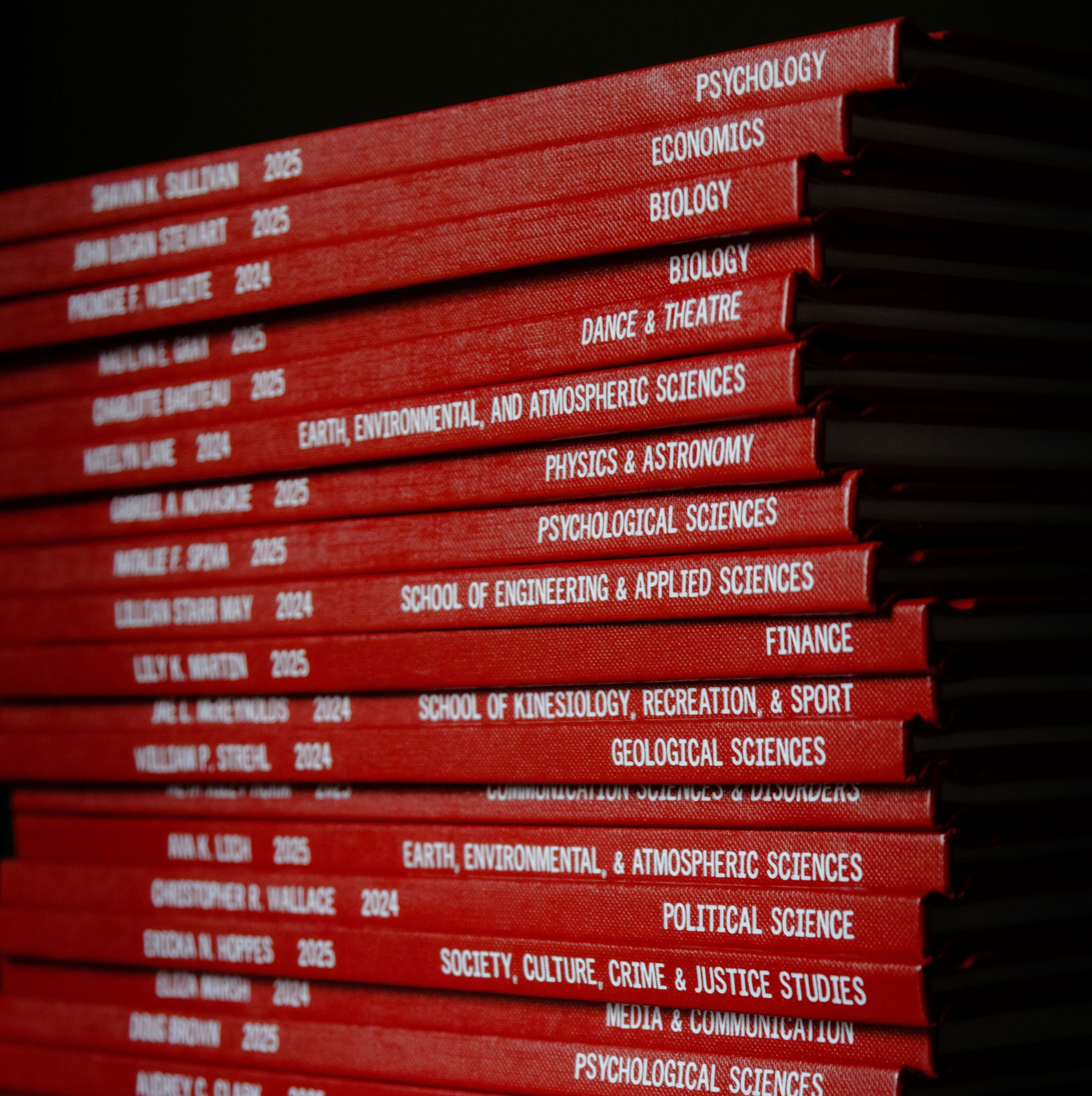 stack of red thesis books