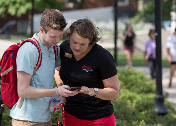 The Director of the WKU Counseling Center helps a student navigate campus on the first day of class