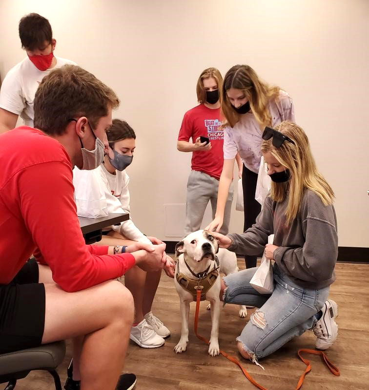 Exercise Science LLC students with a dog