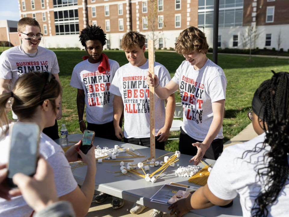 students building a structure with spaghetti and marshmallows