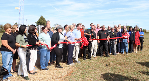 Pictured at Tuesday’s ribbon cutting: Nelson County Emergency Management Director, Brad Metcalf (holding scissors), State Climatologist, Dr. Jerry Brotzge and numerous local, state and federal officials were on hand to cut the ribbon on the new Kentuck