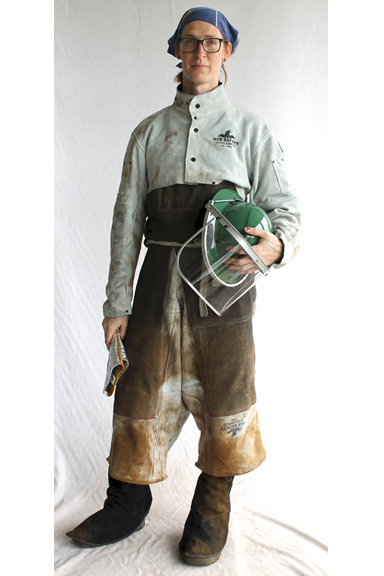 woman in safety gear holding a helmet