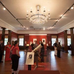 View Guests at the opening enjoyed reading the stories about each of the items on display in the IAE exhibit. Larger