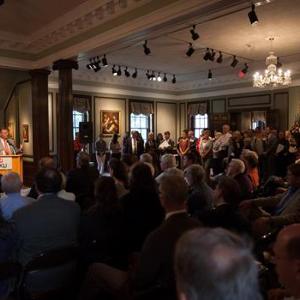 View President Gary Ransdell welcomes a large crowd to the Kentucky Museum for the debut of the IAE exhibit. Larger