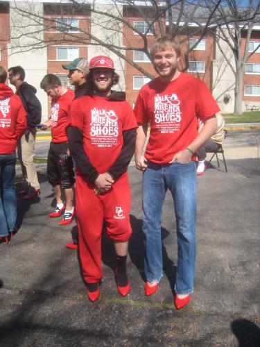Showing off their red pumps for Walk-A-Mile In Her Shoes 2013