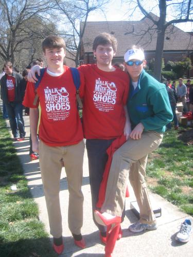 Enjoying the moment and showing off those red pumps in support of Walk-A-Mile In Her Shoes 2013