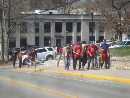 The climb up the Hill begins in those red pumps in support of Walk-A-Mile In Her Shoes 2013