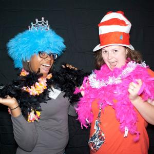 View Two participants wearing props in a photo booth style picture Larger