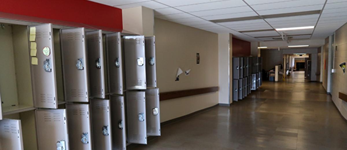 Students lockers have been systematically inventoried and emptied. The floor of the gymnasium acting as a temporarily holding location, each locker’s contents in the designated area. Photograph by Samuel Kendrick