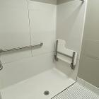 View ADA accessible shower stall in the private bathroom in Normal Hall Larger