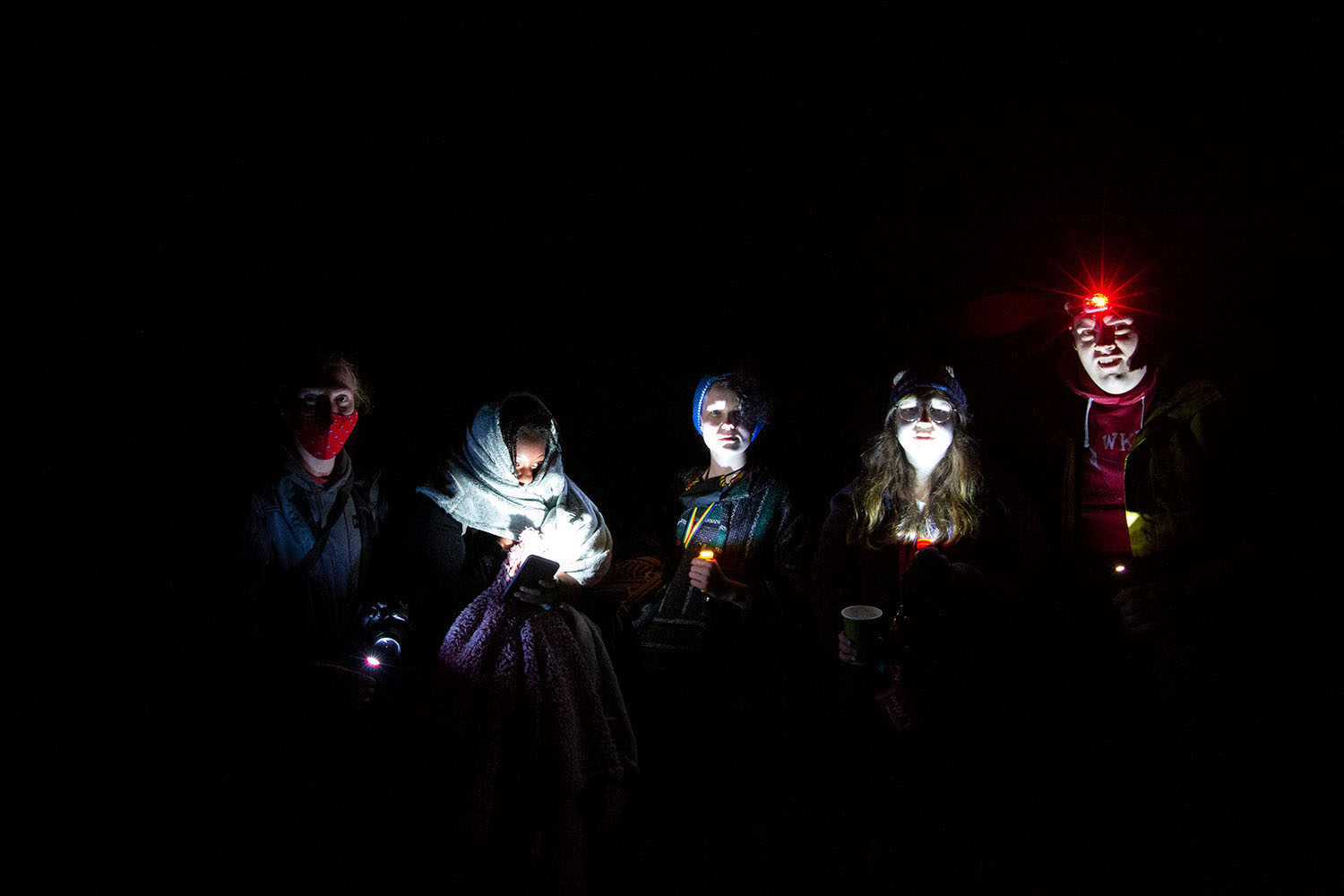 After learning to photograph the night sky at Shanty Hollow outside of Bowling Green, LLC students used flashlights to pose for a group photo.