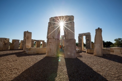View of the (uneclipsed) Sun through one of the pillars at the Stonehenge replica at UTPB (Clinton Lewis/WKU)