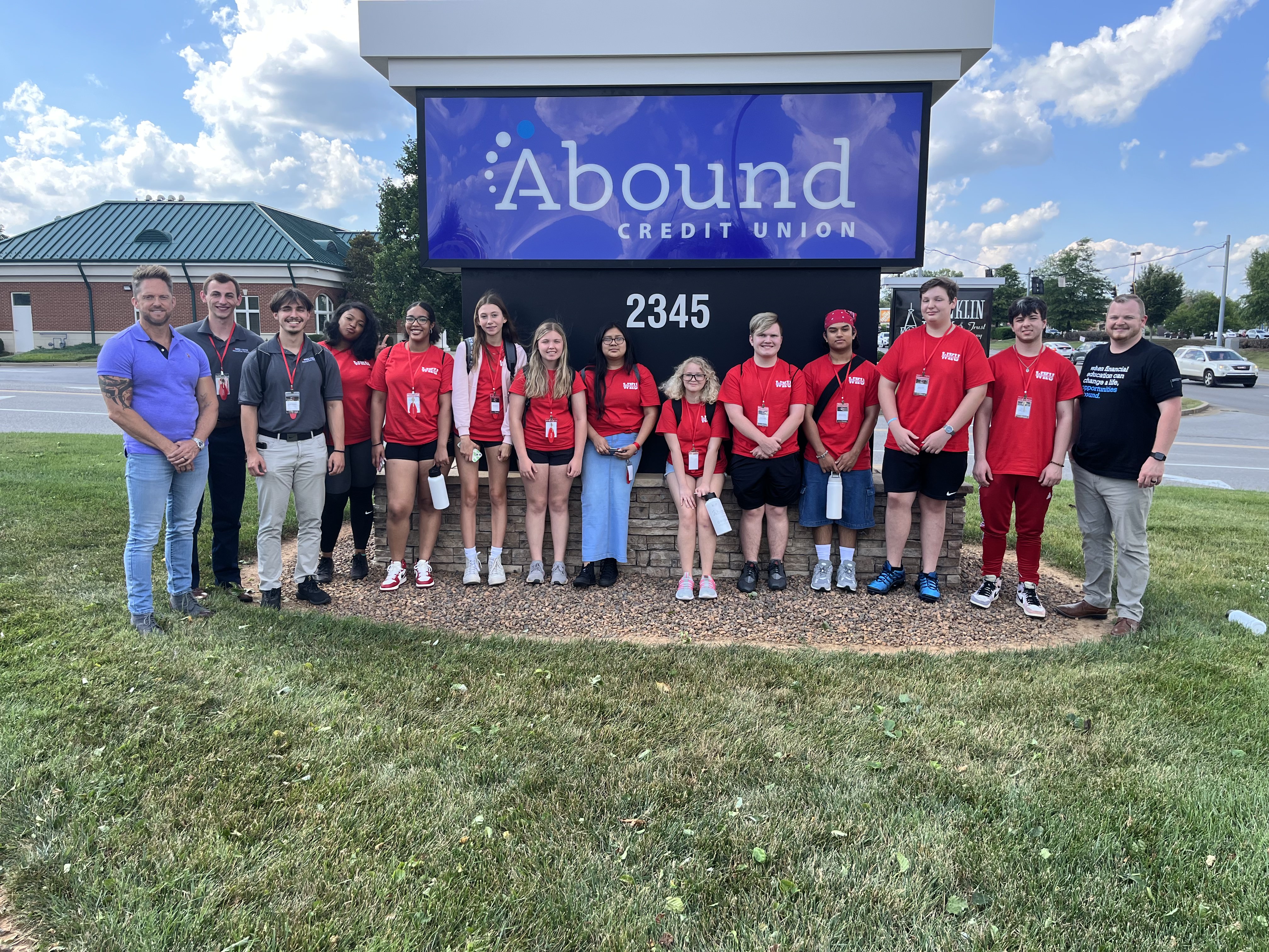 Students pose for a photo at Abound Credit Union, the camp sponsor.
