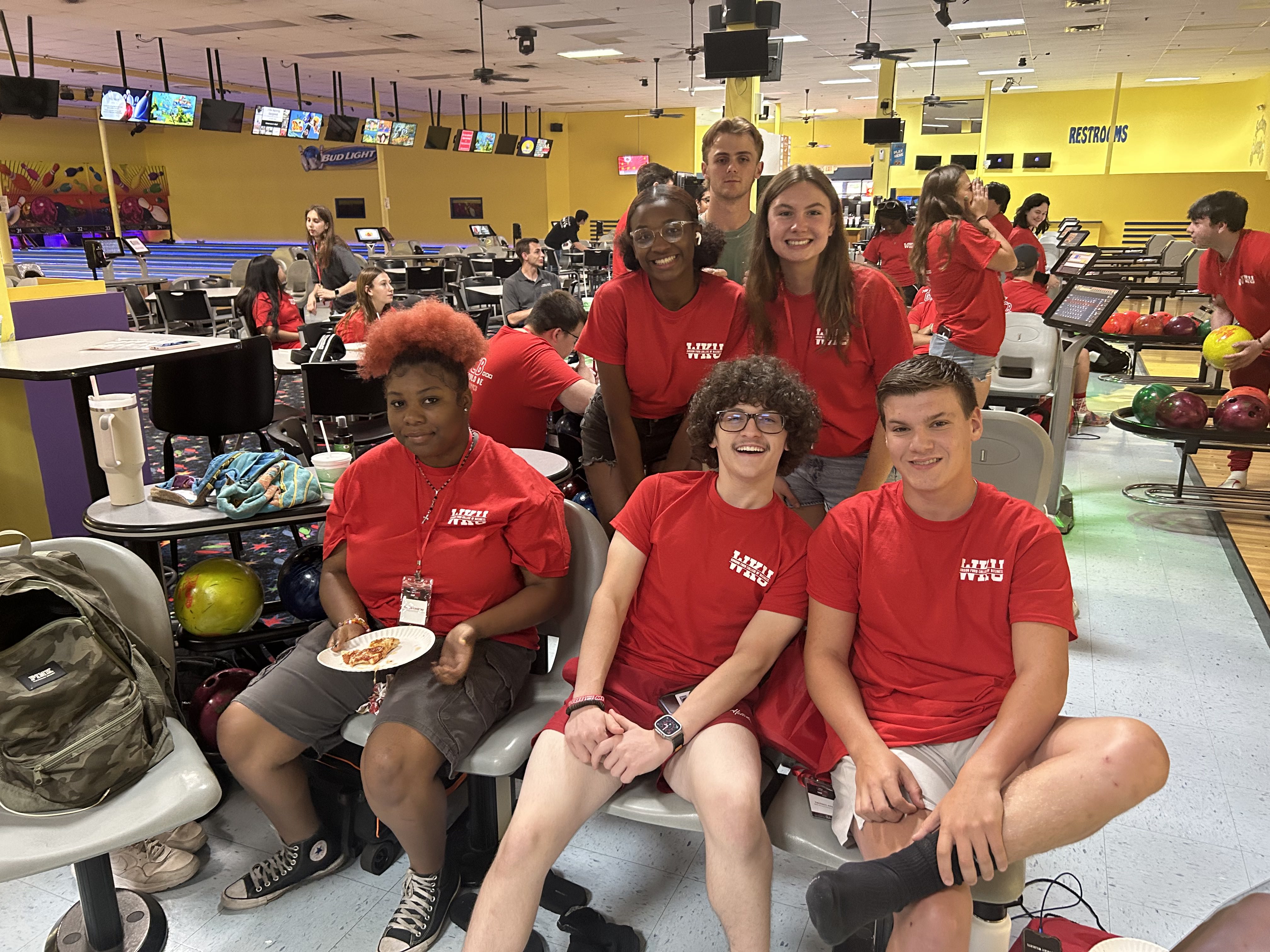 Students pose for a photo during camp bowling night.