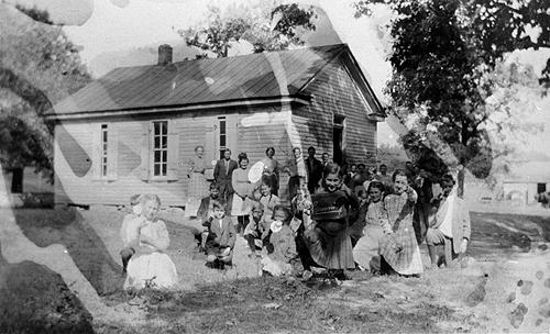In 1919, Mrs. George Hickman taught 53 students at the Browning School. The schoolhouse was protected with a board roof and shutters on it's windows. (Courtesy of Library Special Collections, WKU)