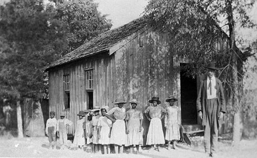 The gentleman standing with the students at the Rockfield School is Austin Cosby a driving force in education for African American students in southeastern Warren County. Schoolteachers between 1909 and 1922 included: (1909); A.S. Dixon (1910); Mattie Stahl (1911); C.S. Dixon (1912-14); Minnie Baily (1915); M.H. Bailey (1916); Mattie Stahl (1917); M.H. Bailey (1918); Maggie King and Josephine Covington (1919); Shelly Read (1920-21); and, Edith Woods and Lula B. Carpenter (1922). (Courtesy of Library Special Collections, WKU)