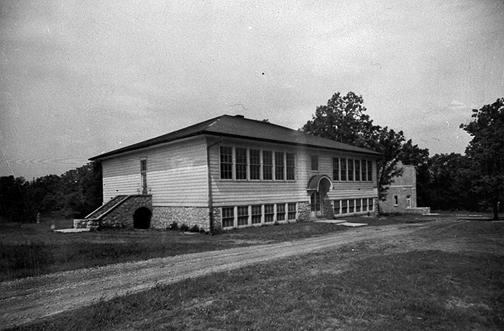 With one classroom located in the basement, Hadley High School housed four classrooms and a principal's office on the first floor. Both constructed in 1927, the designs of the Hadley and Richardsville schools were almost identical. Richardsville's eight-room school was larger. By 1932-33 Hadley offered a four-year course of study in high school work. A gymnasium with a platform stage was constructed in 1938. (Courtesy of Library Special Collections, WKU)