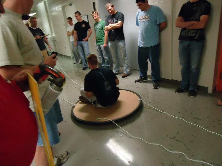 Students in Dr. Harper's University Physics I Laboratory study the relationship between force and motion using a hovercraft. 