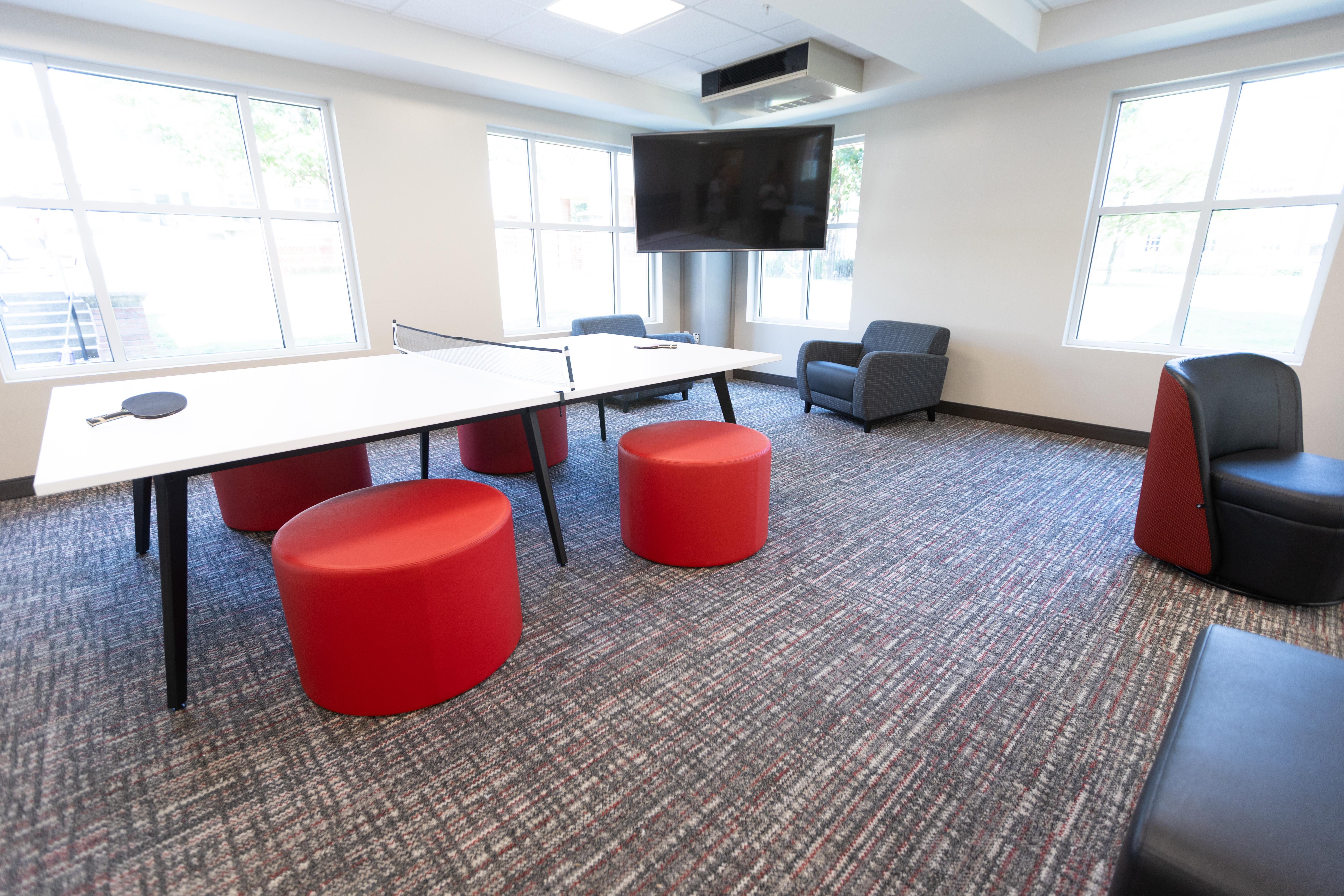 Photo of renovations to the first floor of Southwest Hall, showing a ping pong table and lounge space